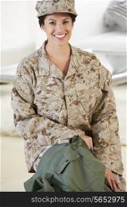 Female Soldier With Kit Bag Home For Leave