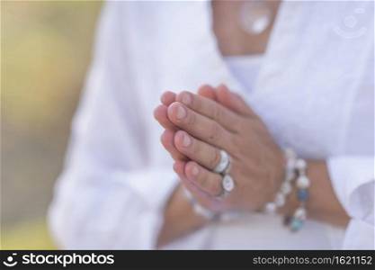 Female spiritual healer practicing mindfulness, sensing and increasing positive energy. Hand gesture. Mindfulness Practice, Increasing Positive Energy, Hand Gesture