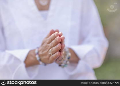 Female spiritual healer practicing mindfulness, sensing and increasing positive energy. Hand gesture. Mindfulness Practice, Increasing Positive Energy, Hand Gesture