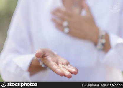 Female spiritual healer practicing mindfulness, sensing and increasing positive energy. Hand gesture. Sending Positive Energy, Hand Gesture, Mindful Meditation