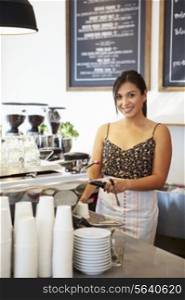 Female Staff In Coffee Shop