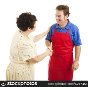 Female store owner congratulates one of her sales clerks. Isolated on white.