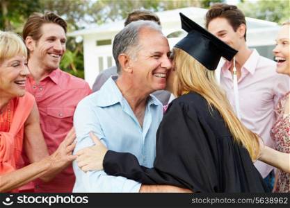 Female Student And Family Celebrating Graduation