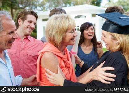 Female Student And Family Celebrating Graduation