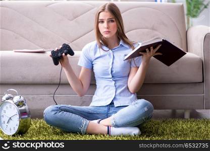 Female student being distracted from exam preparation