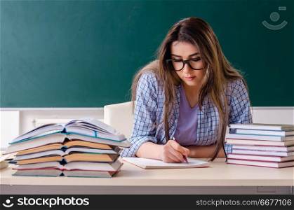Female student in front of chalkboard. Female student in front of chalkboard