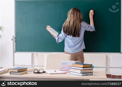 Female student in front of chalkboard. Female student in front of chalkboard 