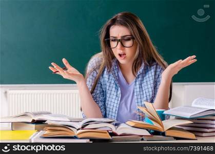 Female student in front of chalkboard. Female student in front of chalkboard 