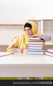 Female student in hijab preparing for exams 