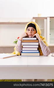 Female student in hijab preparing for exams 