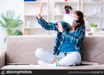 Female student sitting on the sofa with virtual glasses