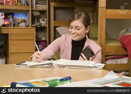 Female student studying in her dormitory
