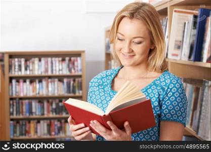 Female Student Studying In Library