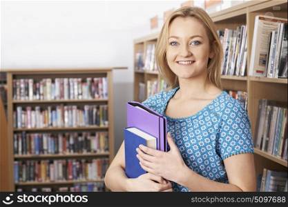 Female Student Studying In Library