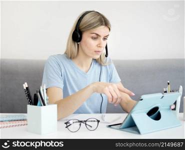 female student using digital tablet
