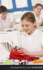 Female student using sewing machine