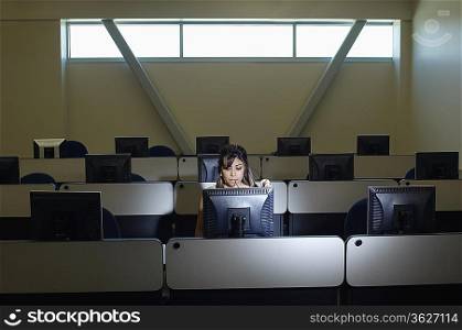 Female student working in computer classroom