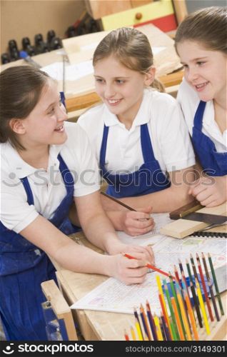 Female students learning woodworking