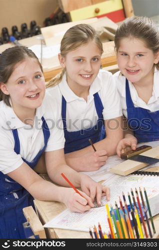 Female students learning woodworking