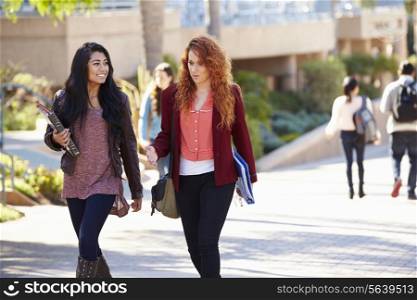 Female Students Walking Outdoors On University Campus