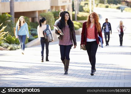 Female Students Walking Outdoors On University Campus