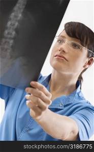 Female surgeon examining an X-Ray