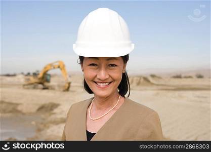 Female surveyor on construction site, portrait