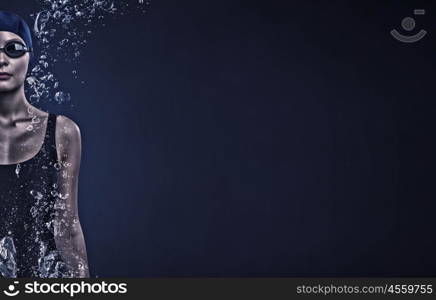 Female swimmer. Portrait of woman swimmer in cap and glasses