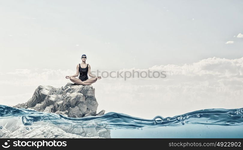 Female swimmer. Young woman meditating swimmer in cap and glasses