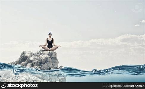 Female swimmer. Young woman meditating swimmer in cap and glasses