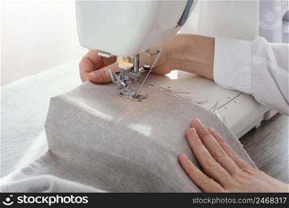 female tailor working with sewing machine