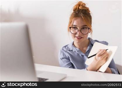 female teacher explaining lesson during online class