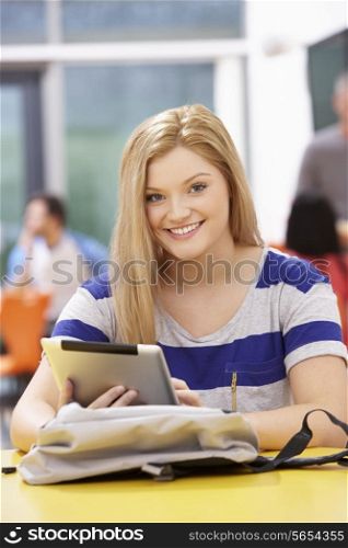 Female Teenage Student In Classroom With Digital Tablet
