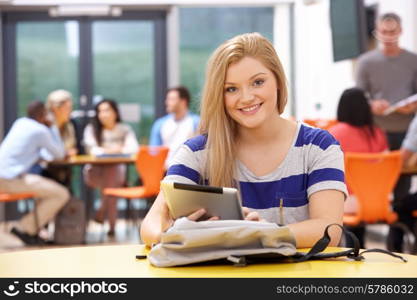 Female Teenage Student In Classroom With Digital Tablet