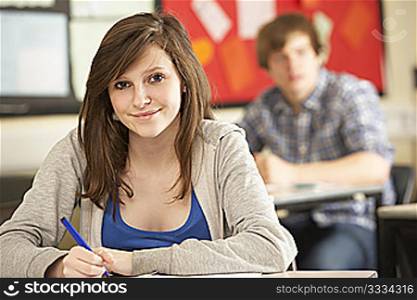Female Teenage Student Studying In Classroom