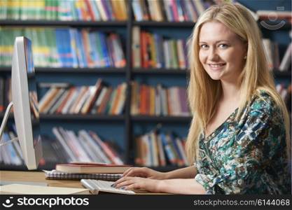 Female Teenage Student Working At Computer In Classroom