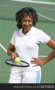 Female tennis player on court, portrait