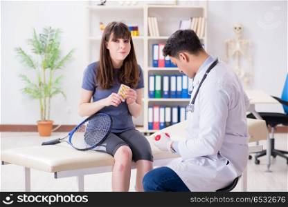 Female tennis player visiting male doctor for check-up