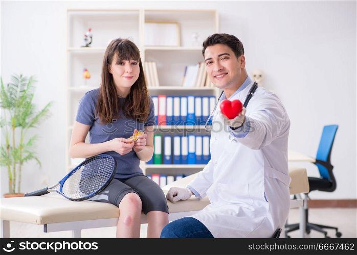 Female tennis player visiting male doctor for check-up