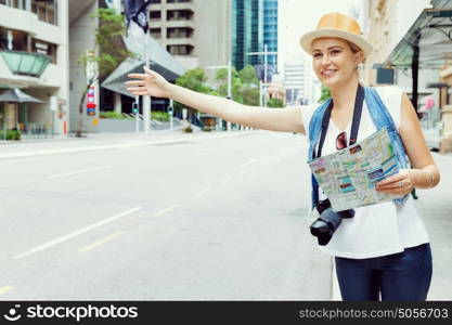 Female tourist calling for a taxi in the city. I need a ride