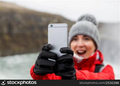 Female tourist having fun and making a selfie