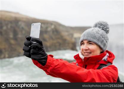 Female tourist having fun and making a selfie