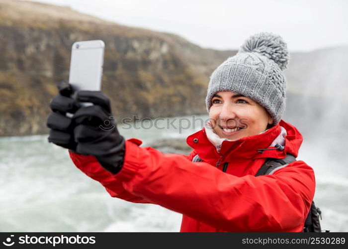 Female tourist having fun and making a selfie