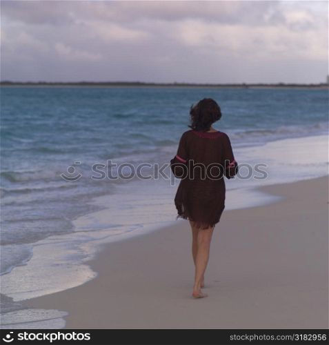 Female tourist on beach at Parrot Cay