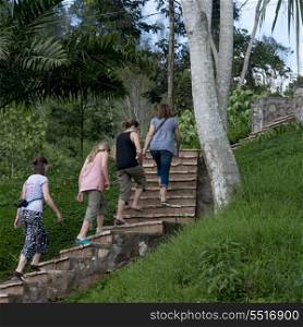 Female tourists moving up on staircase, Finca Santa Isabel, Copan Ruinas, Honduras