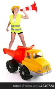 Female traffic guard yelling into a traffic cone and riding a truck