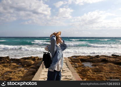 female traveler admiring a marine view. tourism in Cyprus. tourist on sea background. girl travels on the beaches. young beautiful hipster woman on tropical beach, summer vacation, happy, fun. female traveler admiring a marine view. tourism in Cyprus. tourist on sea background. girl travels on the beaches. young beautiful hipster woman on tropical beach, summer vacation, happy, fun,