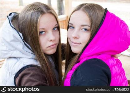 Female twins in hoodies