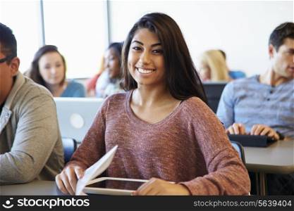 Female University Student Using Digital Tablet In Classroom