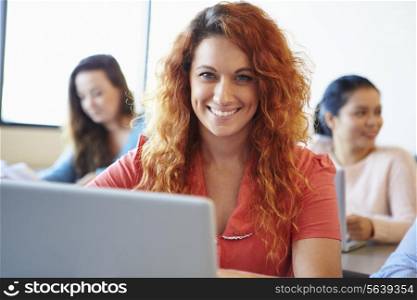 Female University Student Using Laptop In Classroom